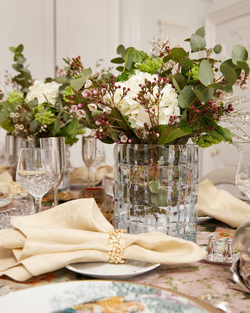 Contemporary dinner with flowers in a glass jar and napkins near the flowers